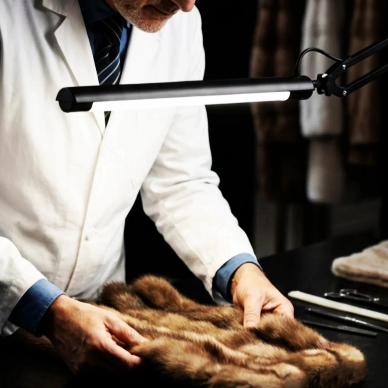 Artisan hands assembling rare sable, chinchilla and mink fur
